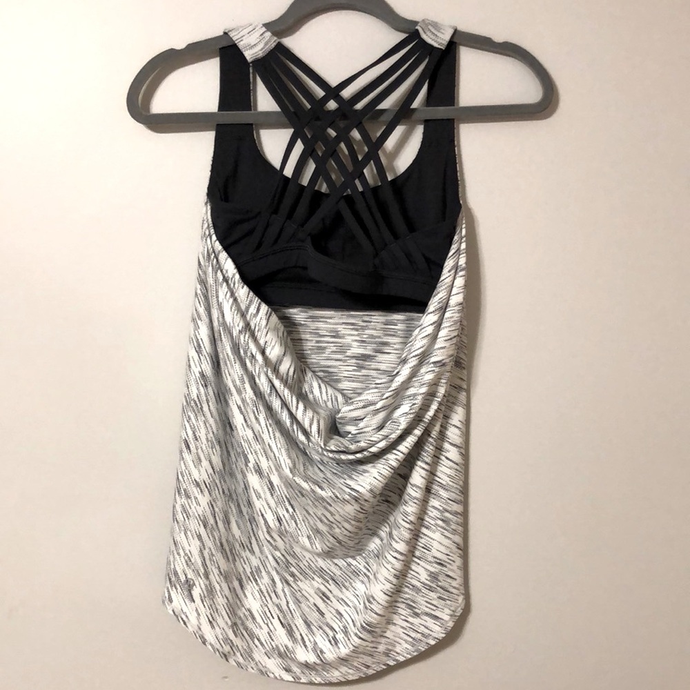 Lululemon workout tank with built in lightly padded sports bra. Size S-4